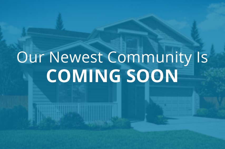 Our newest community is coming soon text over out-of-focus home rendering