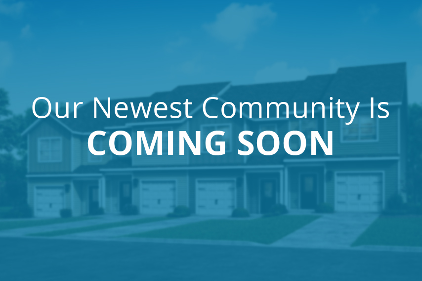 Our Newest Community is Coming Soon text overlaid on out-of-focus townhome rendering