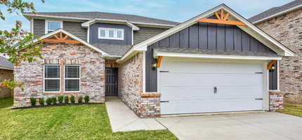 Exterior of a two-story home with brick and siding