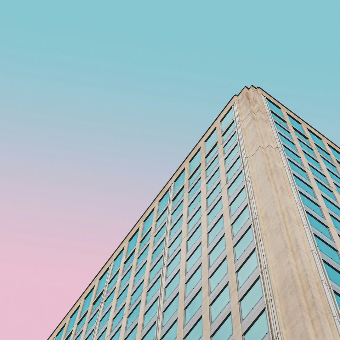 flats against a multicoloured sky