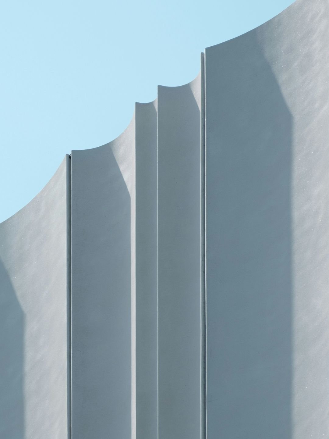 Curved white building