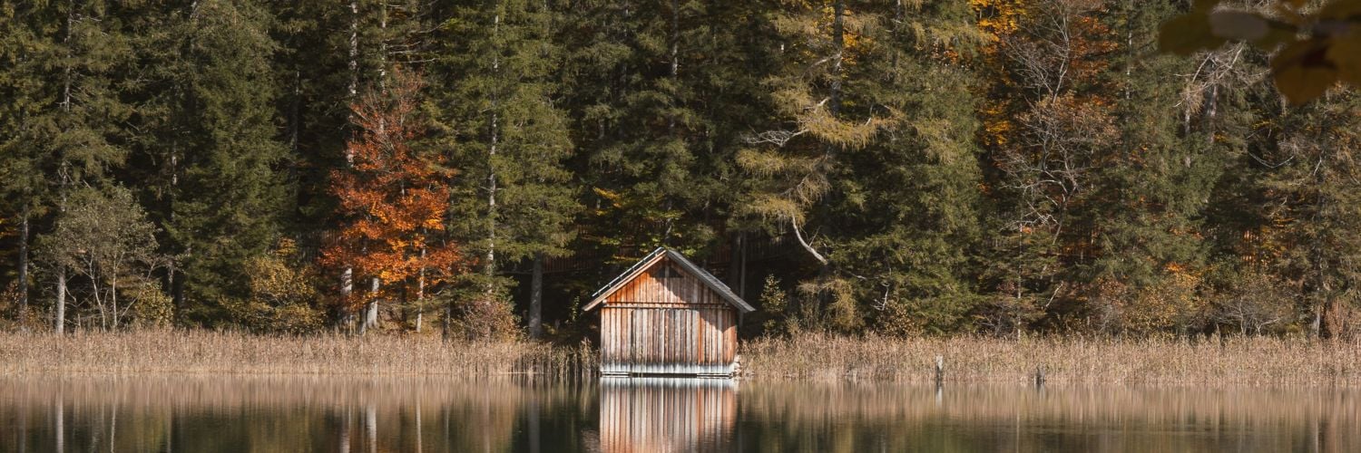Cabin on a lake in autumn