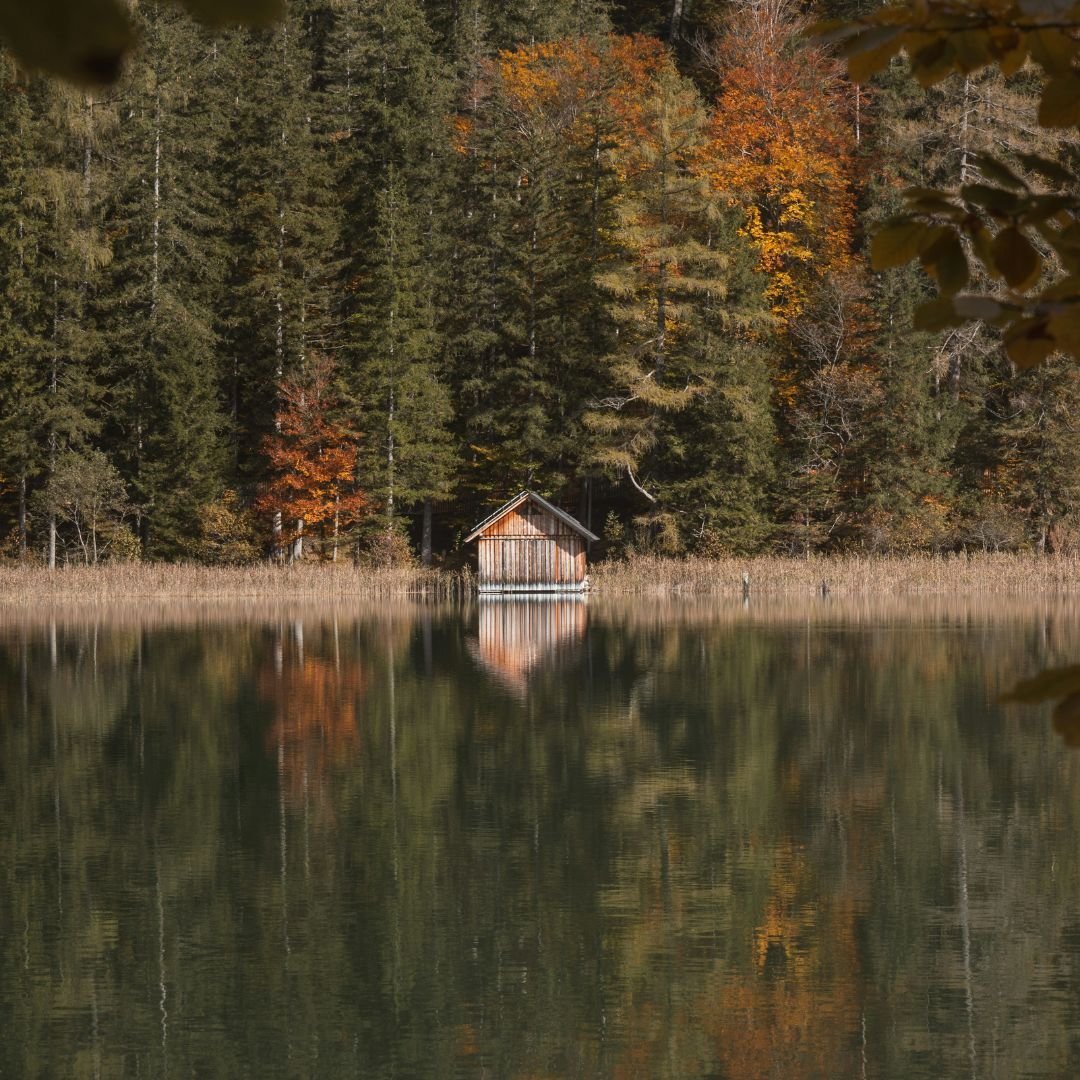 Cabin on a lake in autumn