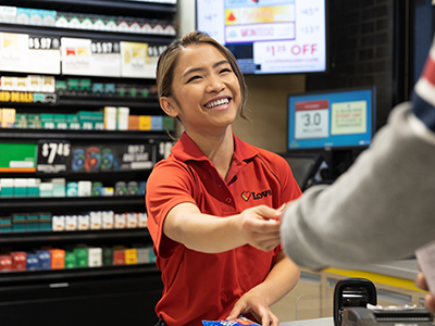 A Love's employee interacting with a customer