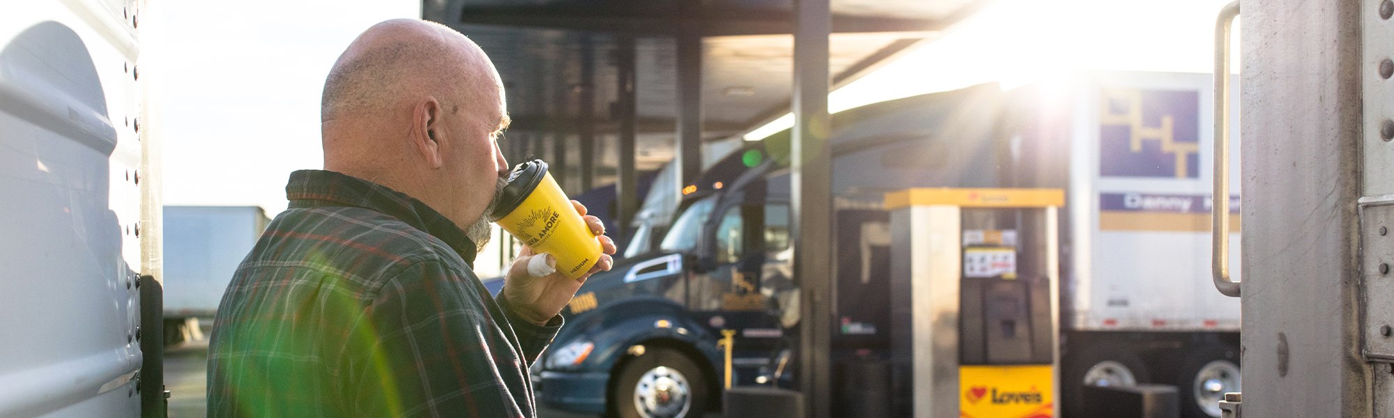 Customer drinking Java Amore cup at diesel fueling bays