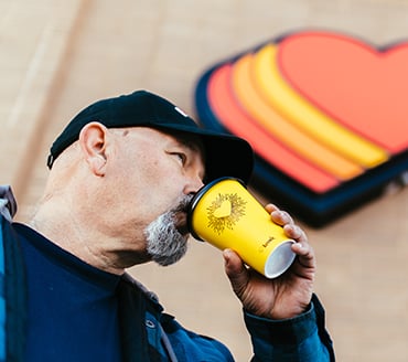 Driver drinking a Love's Coffee
