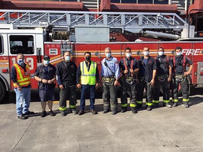 FDNY with Trillium CNG mechanics in front of fire truck