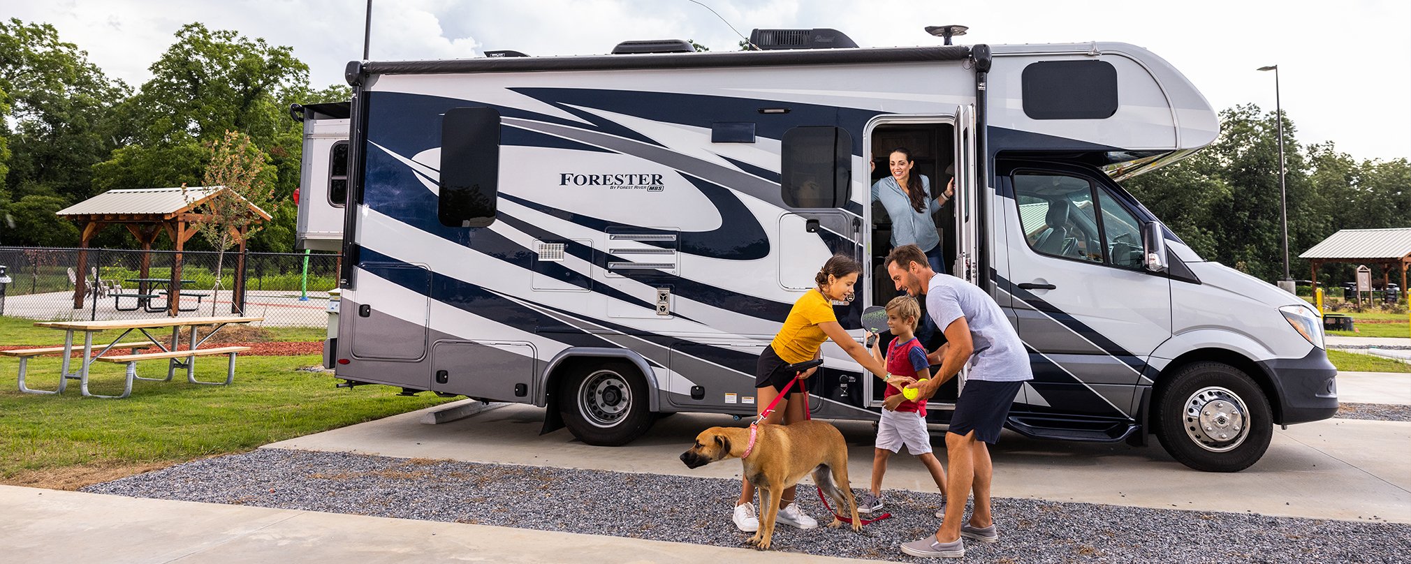 A photo of a family exiting their RV with their dog at Love's RV Stop - Cordele GA 801