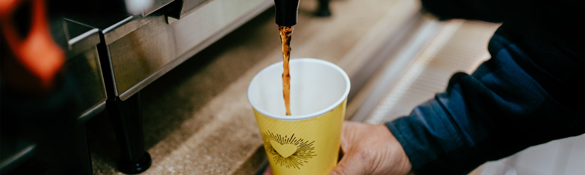 Coffee being poured into a Java Amore Cup