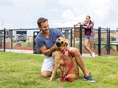 Customers with a dog at a Love's dog park