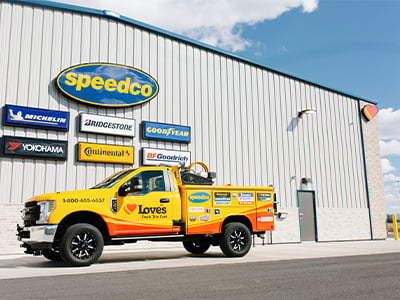 a roadside assistance truck outside a Speedco