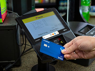 person using contactless payment option on in-store key pad at Love's Travel Stops