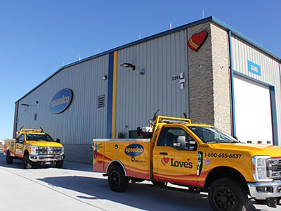 Two Love's roadside assistance trucks outside a Speedco in Wichita, KS