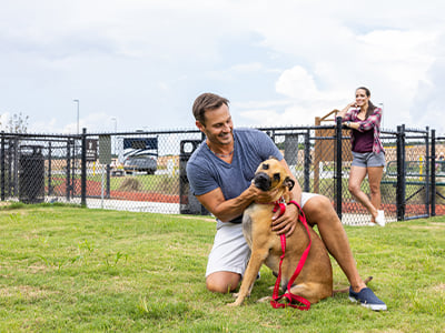 Man and dog at Dog Park at a Love's RV Stop