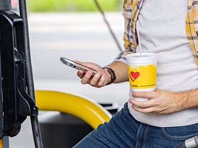 Love's Travel Stop Customer looking at phone