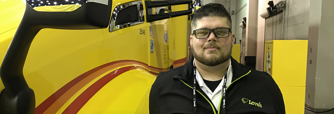 speedco manager james herring smiling next to truck