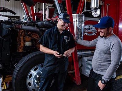 speedco employee with trucker