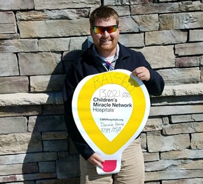 loves employee holding cmn balloon