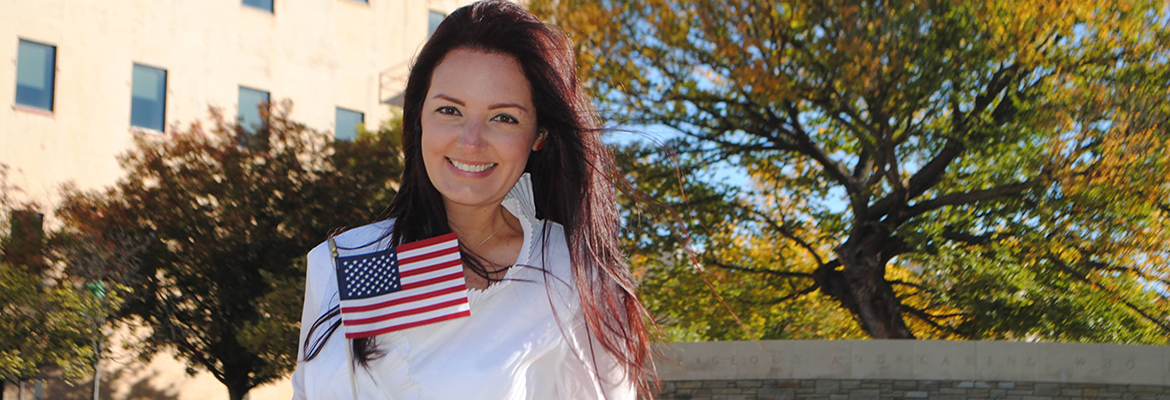 Love's employee Violeta Bingham holding American flag