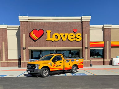 loves travel stop exterior in hamilton alabama with service truck parked in front of it