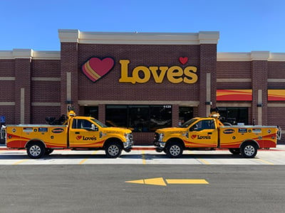 An exterior shot of Store 796 in Newport with Roadside Assistance trucks