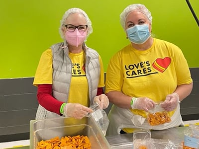 Two Love's employees volunteering the the Regional Food Bank in OKC