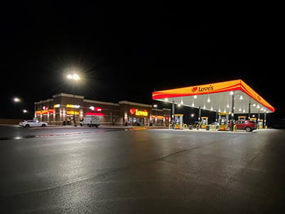 loves travel stop with gas pumps at night time in Winona Texas