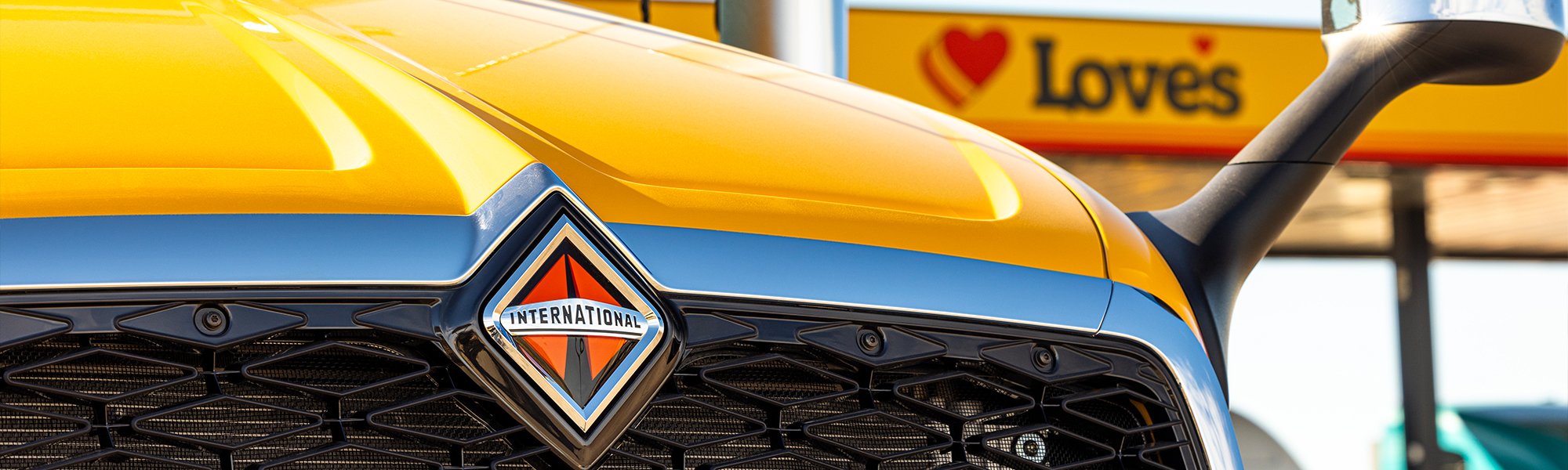 An International truck in front of a Love's canopy