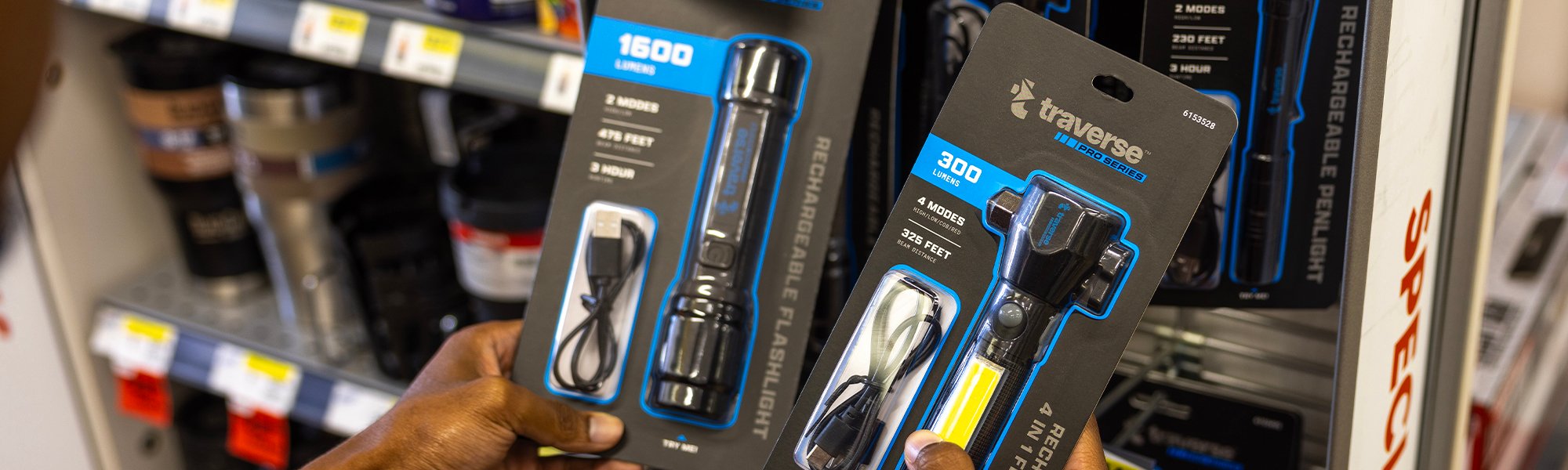 A customer holding a Traverse Pro Series flashlight