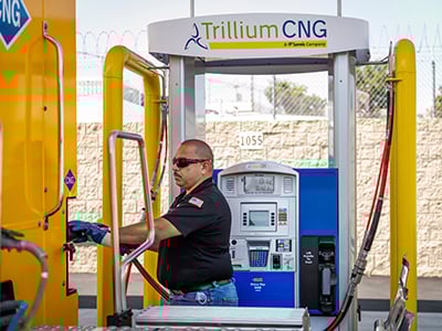 professional driver fueling at Trillium CNG station