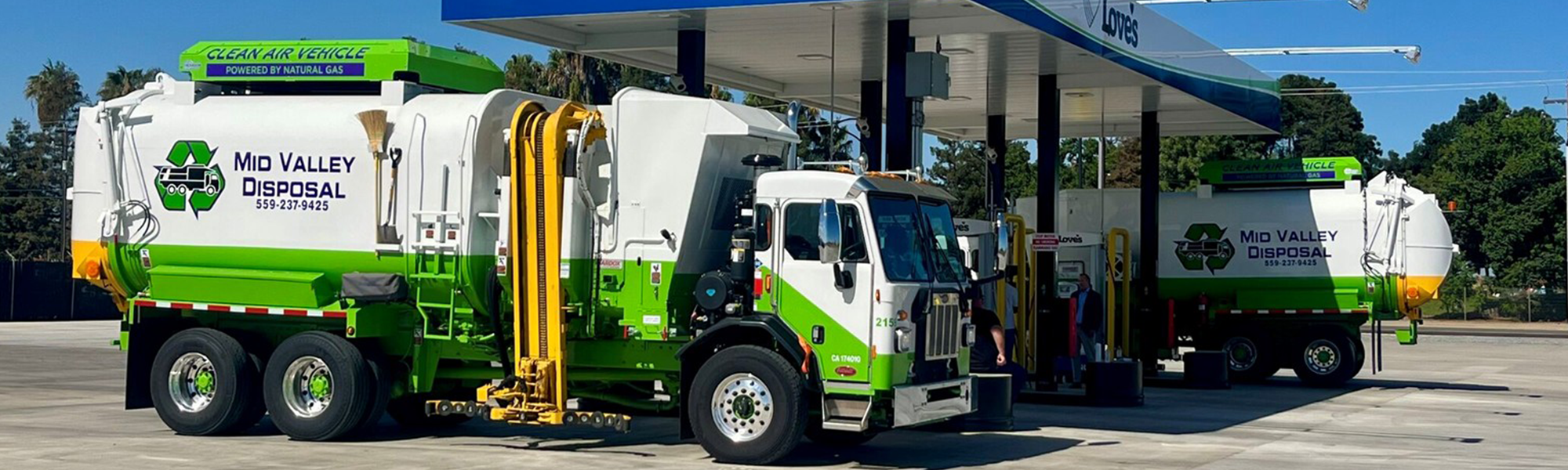 A photo of a waste hauling truck at a Love's Alternative Energy station