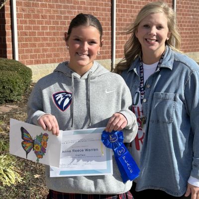 2026 Hospice Butterfly art winner with teacher 400x400