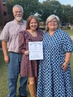 Beth Johnson with husband, Mark, and daughter, Arleigh