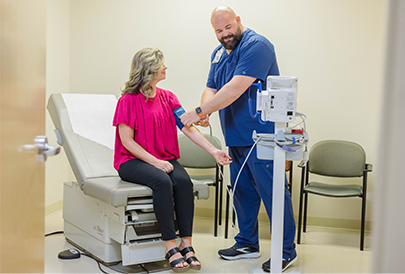 Nurse checking patient vitals