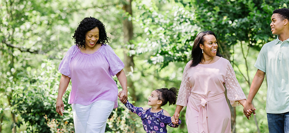 family holding hands and walking together