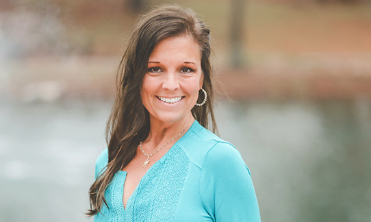 Brandy Young wearing a bright blue shirt
