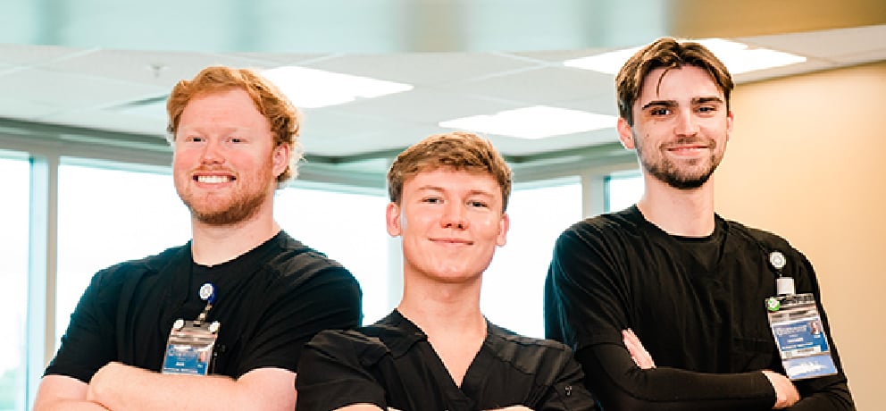 Group of health care students standing and smiling