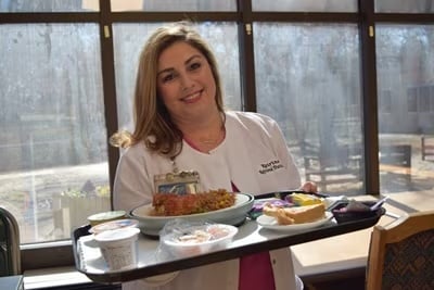 dietitian with meal tray