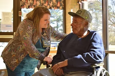 Nurse visiting with resident