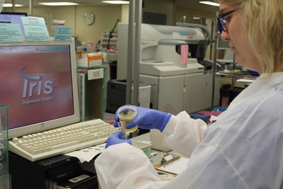 Med tech working with samples in the lab