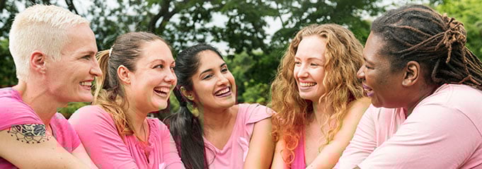 Group of women in pink shirts