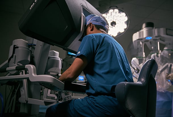 Surgeon looking into a robotic surgery machine