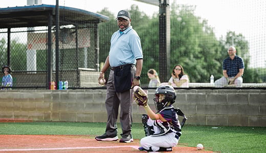 Little league baseball umpire and catcher