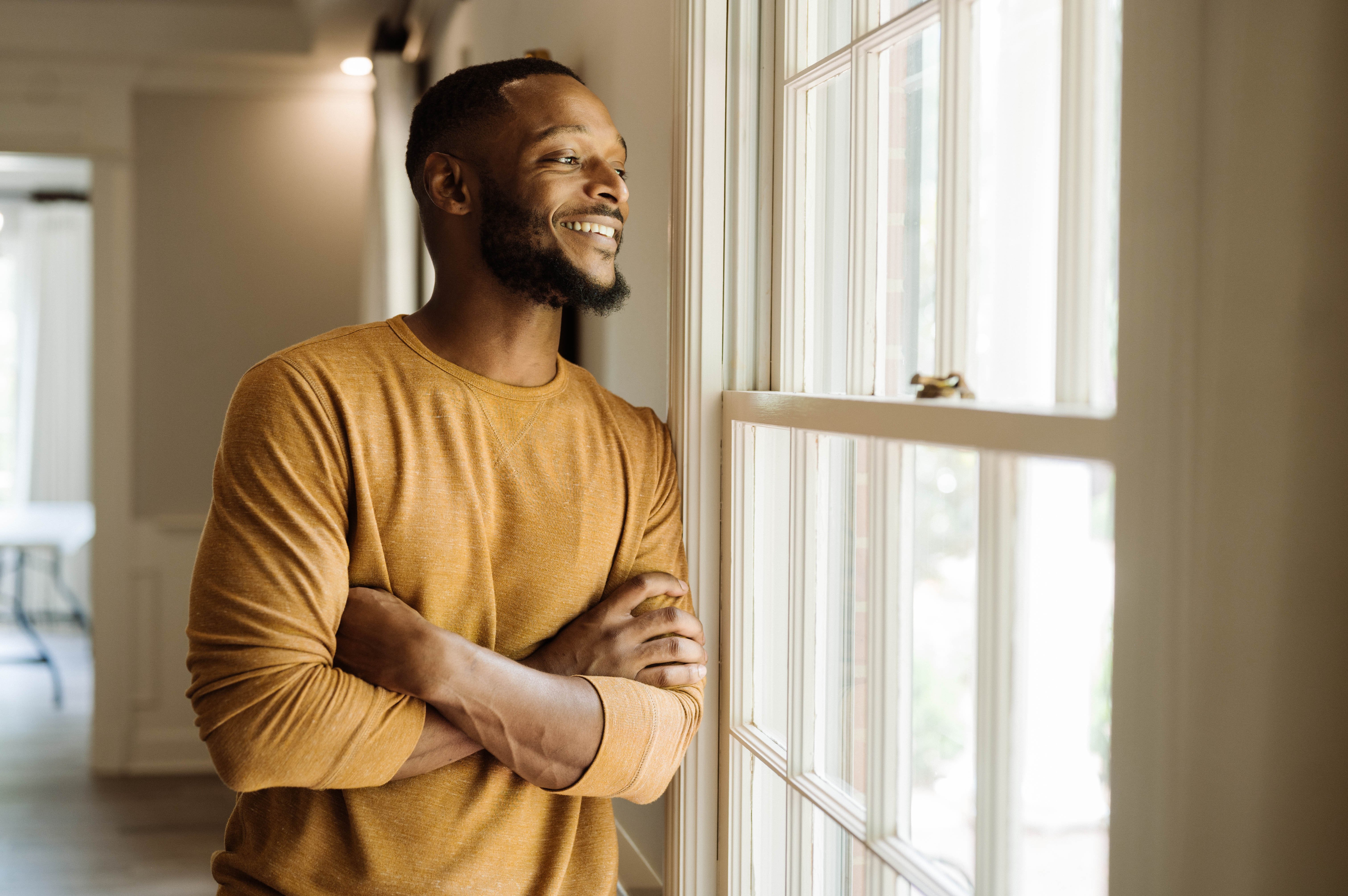 Man looking out the window
