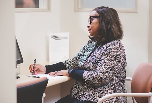 Oncology nurse sitting in desk