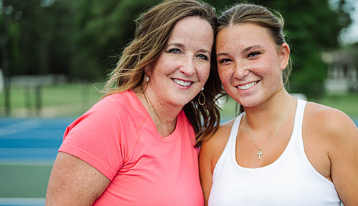 women on a tennis court