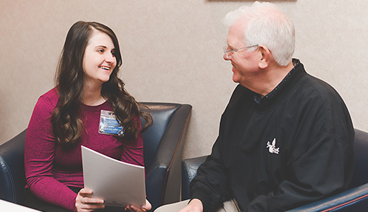 patient and healthcare worker going through paperwork