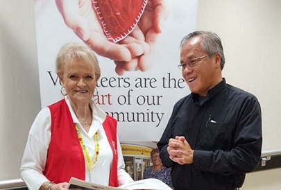 Volunteer accepting award from mended hearts