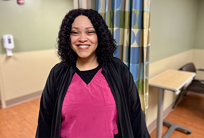 Nurse smiling in hospital room