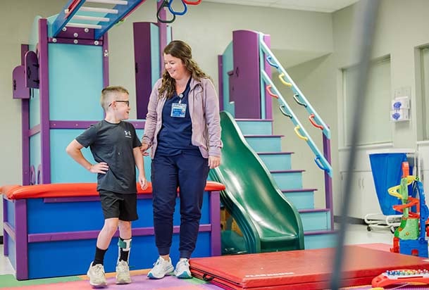 Therapist working with pediatric patient